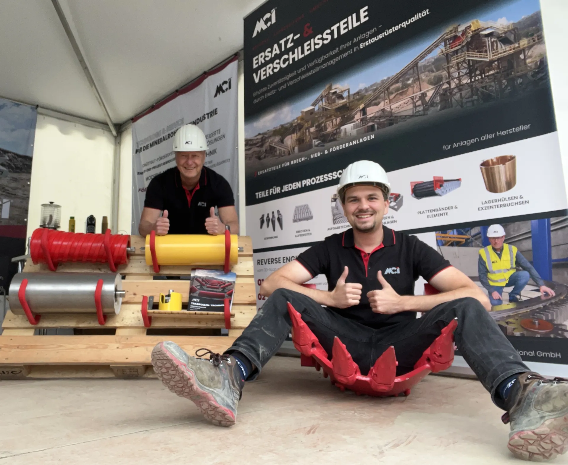 Ulrich Mentges and Joel Bauer at the MCI trade fair booth — One Team One Mission Endless Spirit